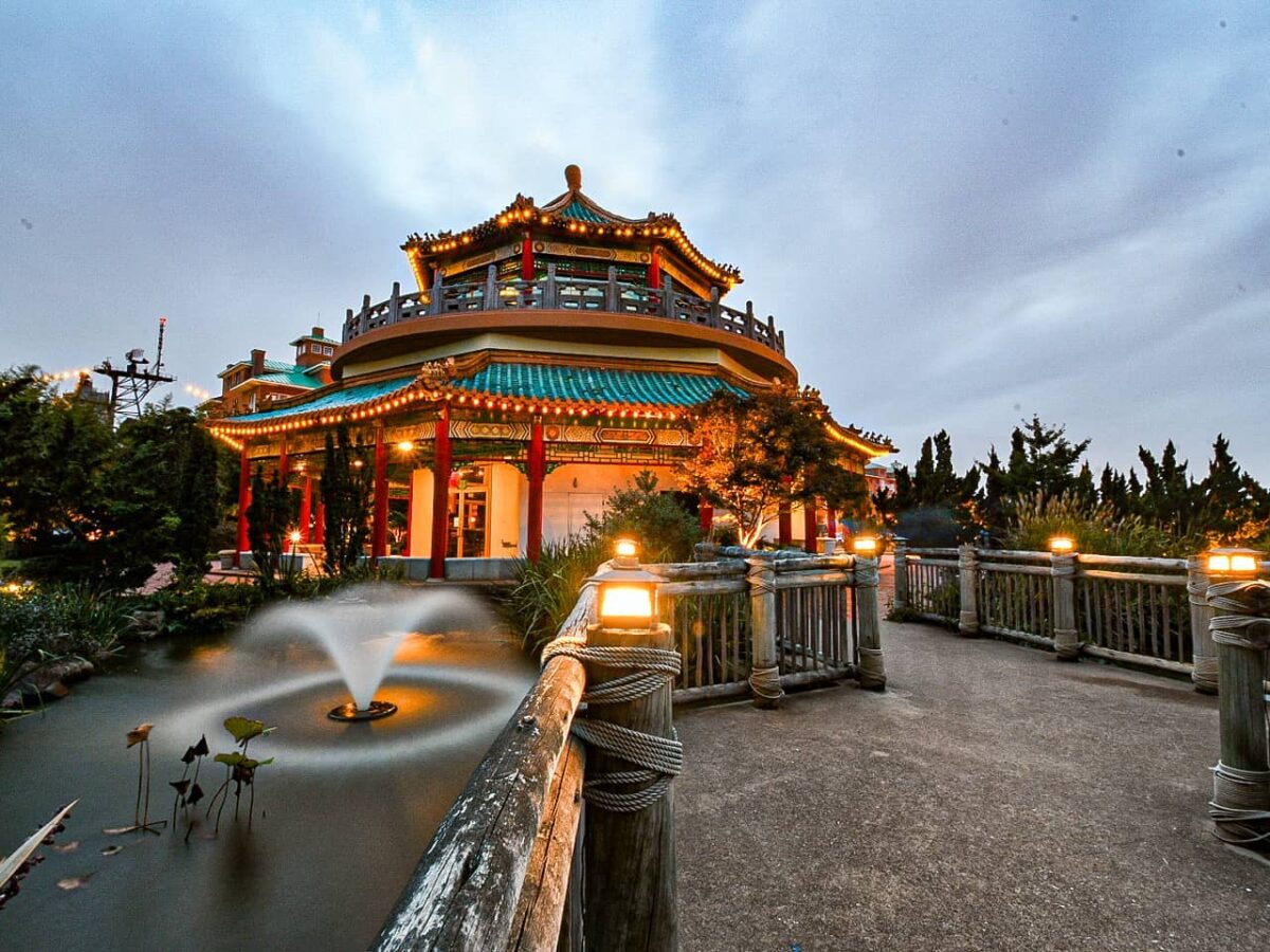 The pagoda and a small fountain illuminated at night